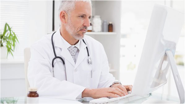 doctor working on a computer