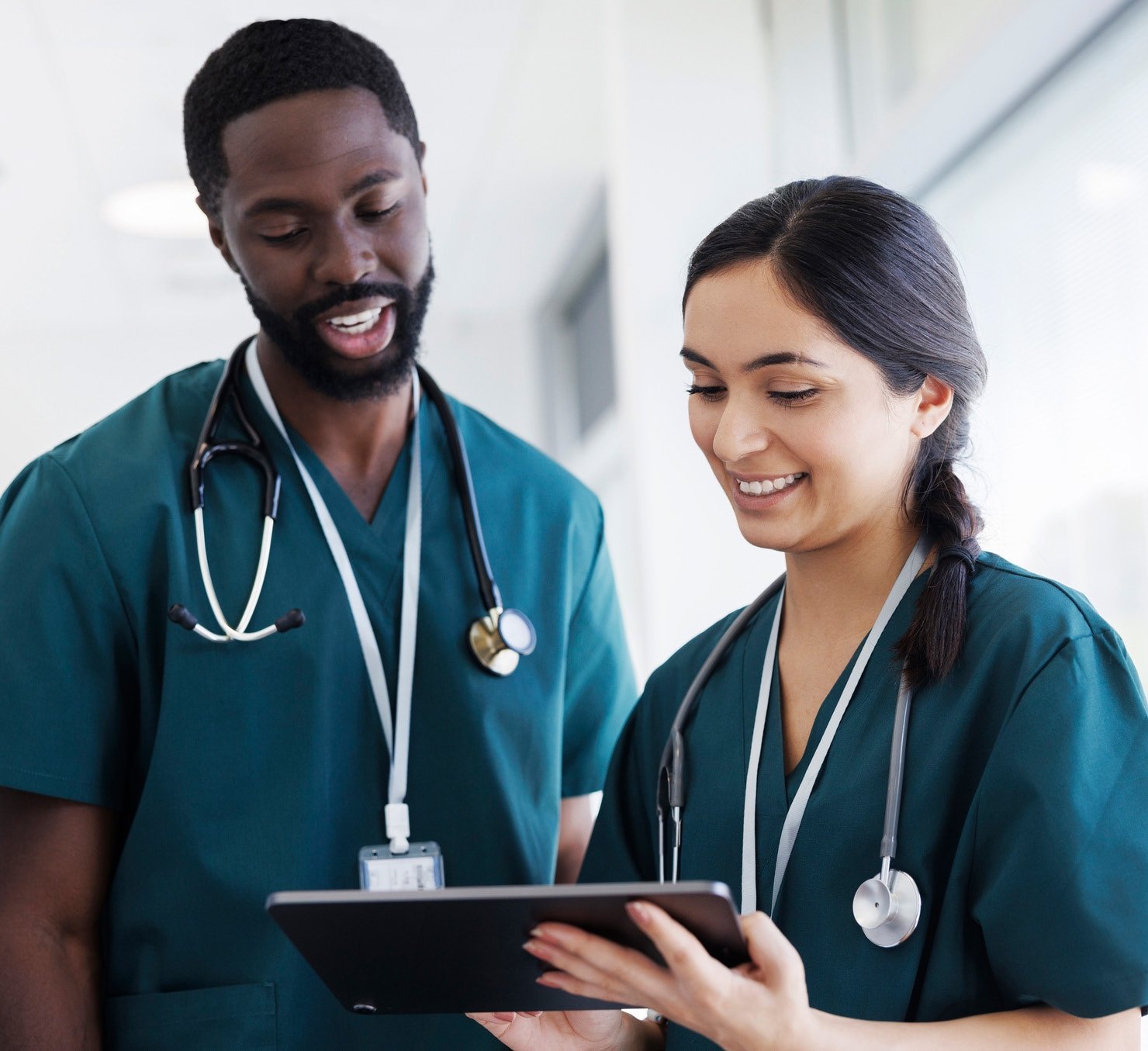 providers talking, one of them holding ipad