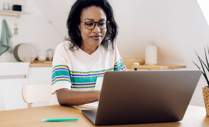 woman looking at her laptop