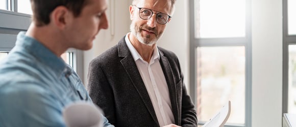 two man collaborating healthcare funding and grants