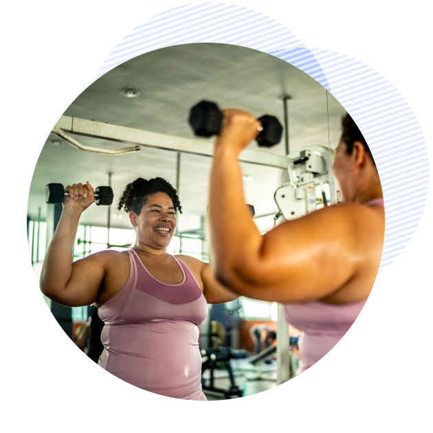 woman lifting weights at the gym
