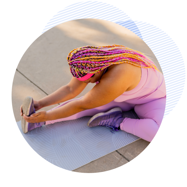 vida woman stretching on a yoga mat