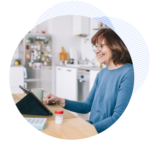older female patient smiling while talking online with her provider