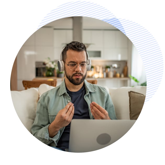 bh patient talking to a therapist on his laptop