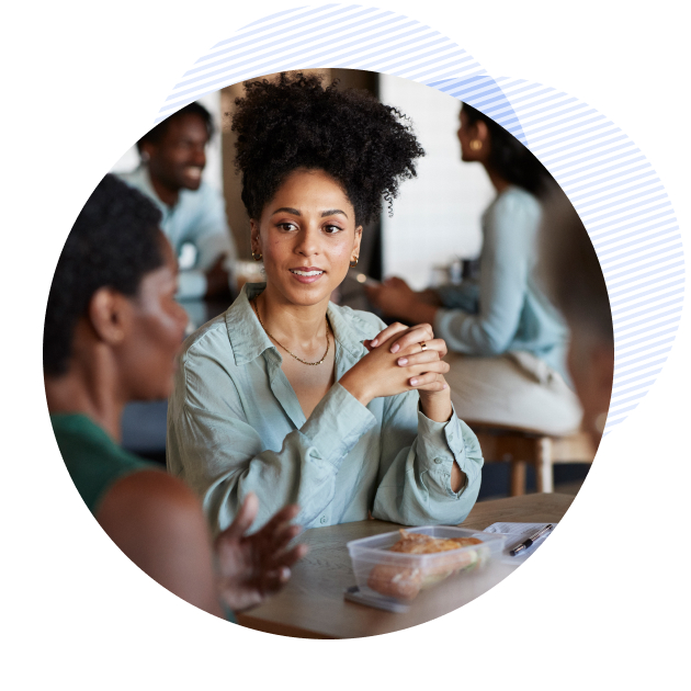 woman eating a lunch with her colleagues