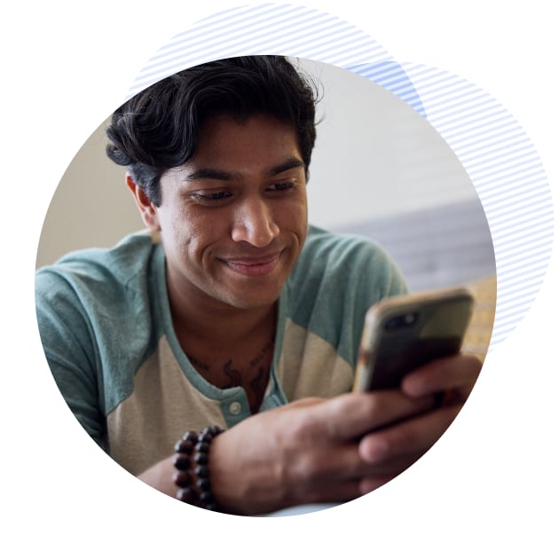 smiling male patient talking to a therapist on his phone