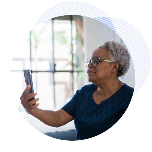 a female patient holding her phone and talking to her therapist