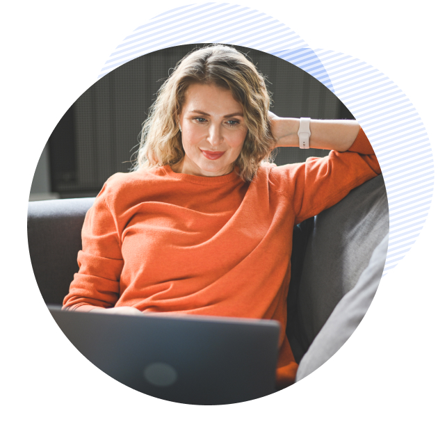 a patient on her laptop, on her couch talking to a behavioral therapist