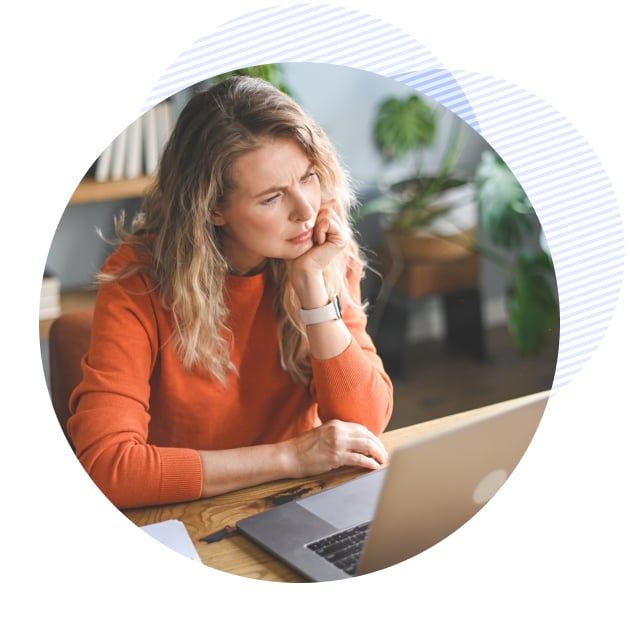 woman on her laptop looks puzzled