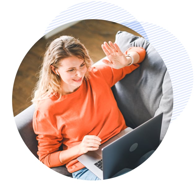 a patient on her laptop waving