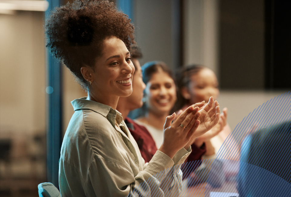 Happy woman clapping at the meeting