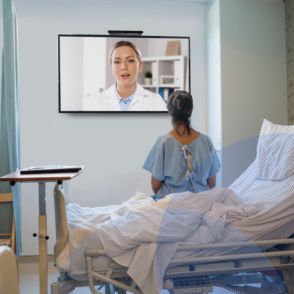 patient talking to a provider via TV kit in a hospital