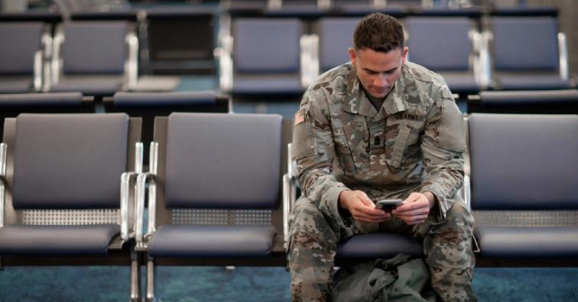 Soldier looking at his phone
