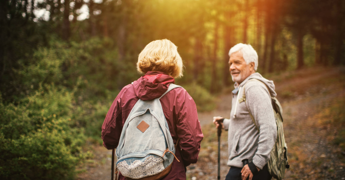 two people hiking in the woods man and woman