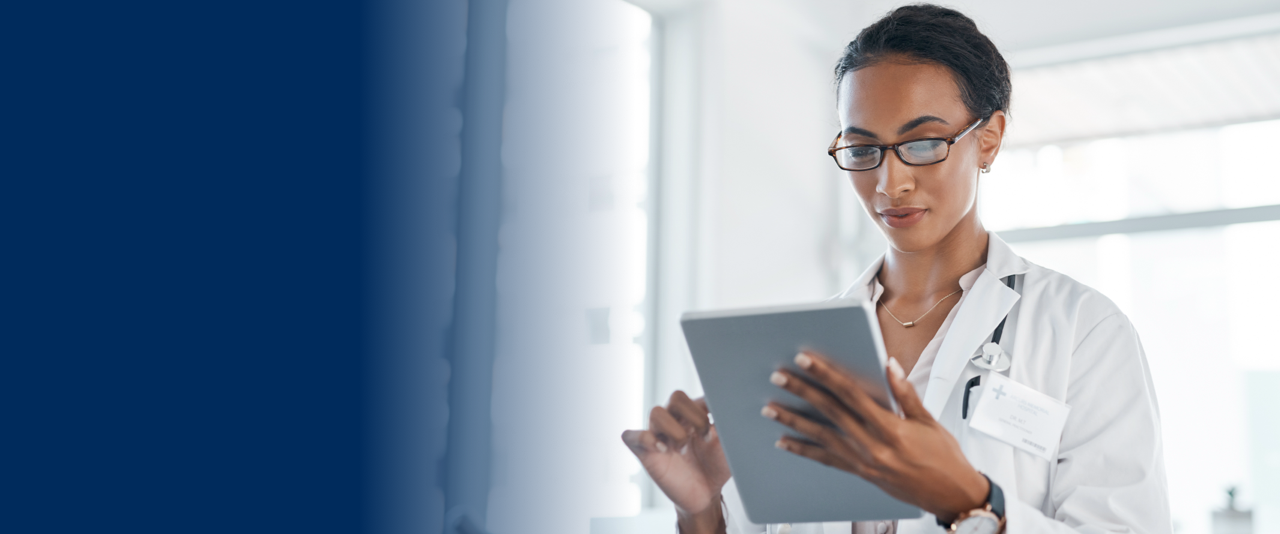 female doctor looking at the iPad
